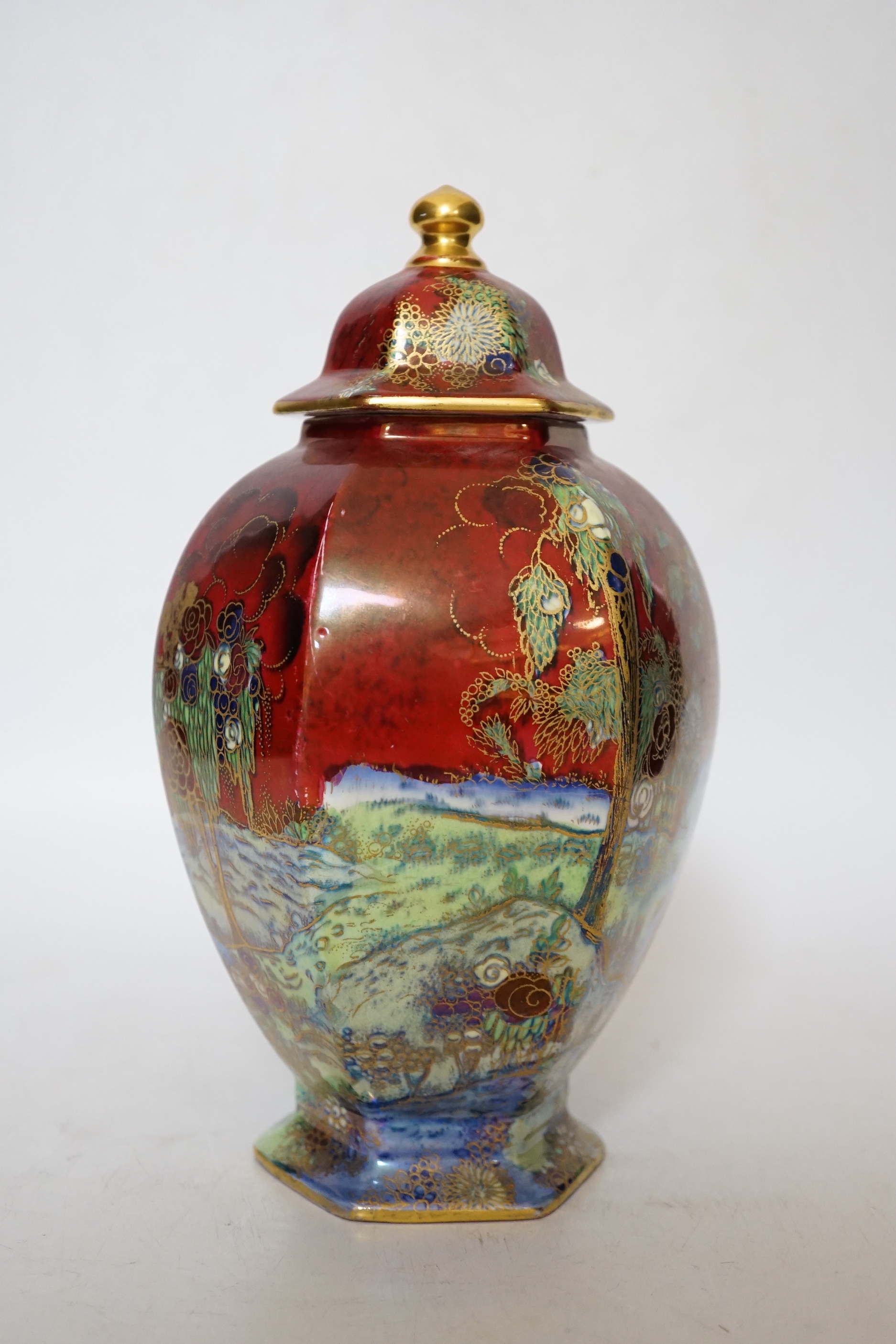A Wilton ware lustre hexagonal lidded vase, numbered and stickered to underside A.G. Harley Jones, 23.5cm